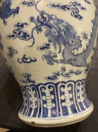 A Chinese blue and white 'dragons and phoenixes' vase and cover, Kangxi mark, 19th C.