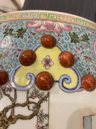 A Chinese famille rose garden seat with ladies in a garden, 20th C.