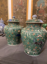 A pair of Chinese famille verte 'galloping horses' vases and covers, 19th C.