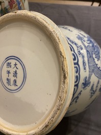 A Chinese blue and white 'dragons and phoenixes' vase and cover, Kangxi mark, 19th C.