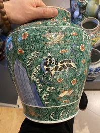 A pair of Chinese famille verte 'galloping horses' vases and covers, 19th C.