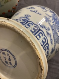 A Chinese blue and white 'dragons and phoenixes' vase and cover, Kangxi mark, 19th C.