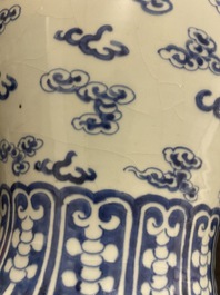 A Chinese blue and white 'dragons and phoenixes' vase and cover, Kangxi mark, 19th C.