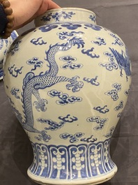 A Chinese blue and white 'dragons and phoenixes' vase and cover, Kangxi mark, 19th C.