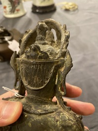A Chinese bronze Buddha and a peach-shaped incense burner, Ming and Qing