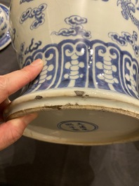 A Chinese blue and white 'dragons and phoenixes' vase and cover, Kangxi mark, 19th C.