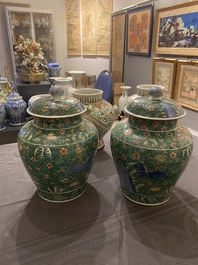 A pair of Chinese famille verte 'galloping horses' vases and covers, 19th C.