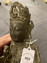 A Chinese bronze Buddha and a peach-shaped incense burner, Ming and Qing