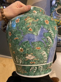 A pair of Chinese famille verte 'galloping horses' vases and covers, 19th C.