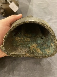 A Chinese bronze Buddha and a peach-shaped incense burner, Ming and Qing