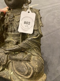 A Chinese bronze Buddha and a peach-shaped incense burner, Ming and Qing