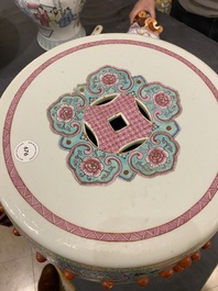 A Chinese famille rose garden seat with ladies in a garden, 20th C.