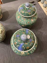 A pair of Chinese famille verte 'galloping horses' vases and covers, 19th C.
