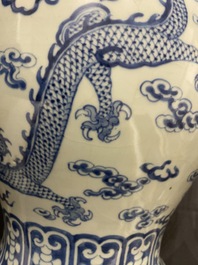 A Chinese blue and white 'dragons and phoenixes' vase and cover, Kangxi mark, 19th C.