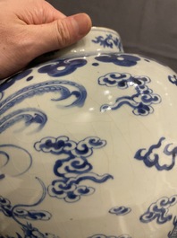 A Chinese blue and white 'dragons and phoenixes' vase and cover, Kangxi mark, 19th C.
