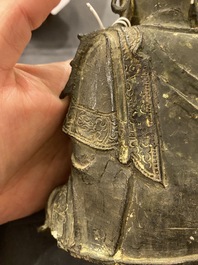 A Chinese bronze Buddha and a peach-shaped incense burner, Ming and Qing