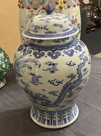 A Chinese blue and white 'dragons and phoenixes' vase and cover, Kangxi mark, 19th C.