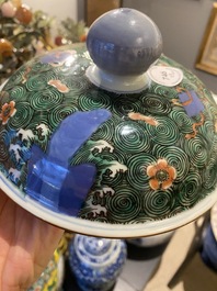 A pair of Chinese famille verte 'galloping horses' vases and covers, 19th C.