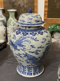 A Chinese blue and white 'dragons and phoenixes' vase and cover, Kangxi mark, 19th C.