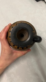 An Etruskian 'aryballos' portrait ewer and a 'patera' dish with black geometrical design, 4th C. b.C.
