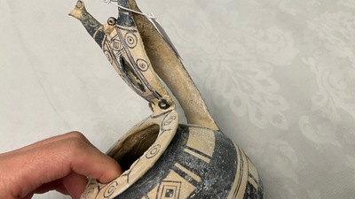 Two geometrical decorated Daunian pottery vessels and an olive press, Southern Italy, 6th/3rd C. b.C.