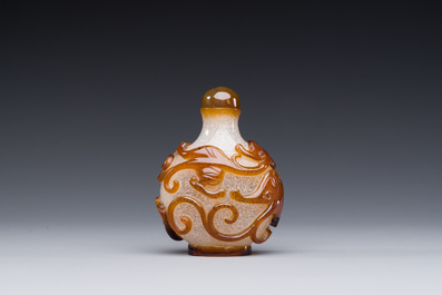 A rare Chinese brown-overlay white glass snuff bottle with chilong design, Qianlong/Jiaqing