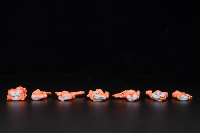 A set of seven Chinese red coral figures on wooden stand, 19/20th C.