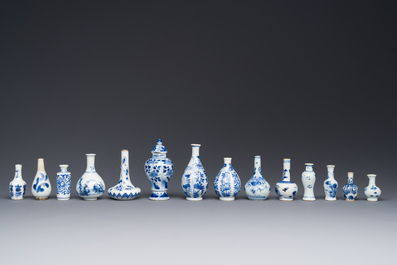 Fourteen Chinese blue and white miniature vases with floral design, Kangxi
