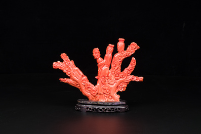 A Chinese red coral group of ladies with playing children on wooden stand, 19/20th C.