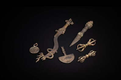 A varied collection of Tibetan bronze, iron and copper alloy ritual instruments, 14th C. and later