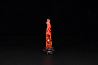 A Chinese red coral group of ladies with playing children on wooden stand, 19/20th C.