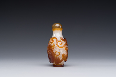 A rare Chinese brown-overlay white glass snuff bottle with chilong design, Qianlong/Jiaqing