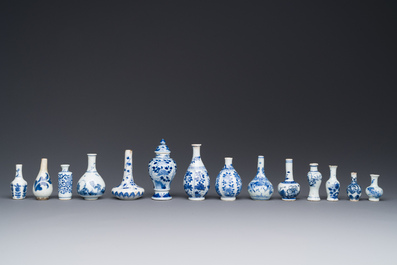 Fourteen Chinese blue and white miniature vases with floral design, Kangxi