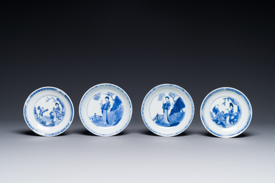 Four Chinese blue and white saucers and an 'erotic' cup, Kangxi