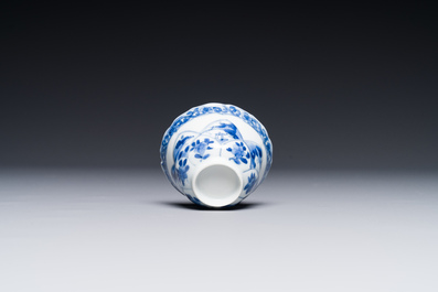 Four Chinese blue and white saucers and an 'erotic' cup, Kangxi