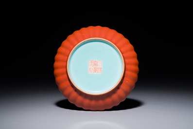 A Chinese coral-red-glazed gilt-decorated 'lotus scroll' saucer, Jiaqing mark, Republic