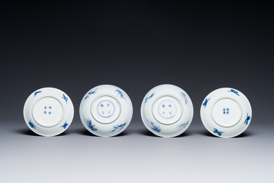 Four Chinese blue and white saucers and an 'erotic' cup, Kangxi