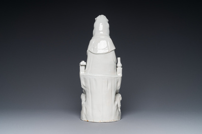 A Chinese Dehua blanc de Chine group of Guanyin with a child and servants, 18th C.