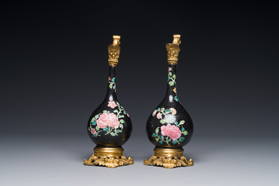 A pair of Chinese black-ground famille rose vases with gilt bronze mounts, Yongzheng