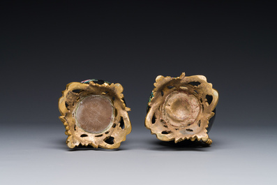 A pair of Chinese black-ground famille rose vases with gilt bronze mounts, Yongzheng
