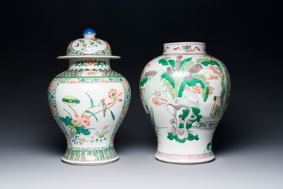 Two Chinese famille verte covered vases on wooden stands, 19th C.