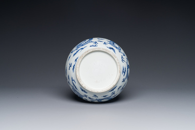 A Chinese blue and white bottle vase with dragons among flames and clouds, 19th C.