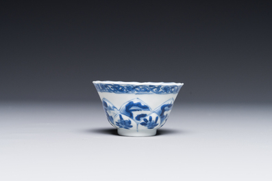 Four Chinese blue and white saucers and an 'erotic' cup, Kangxi