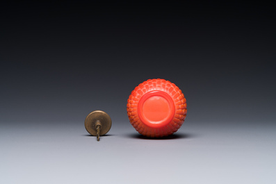 A Chinese coral-red Peking glass snuff bottle imitating a basket, 19th C.