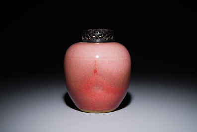 A Chinese monochrome copper-red-glazed ginger jar with a reticulated wooden cover, 18/19th C.