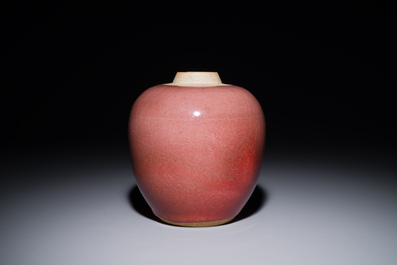 A Chinese monochrome copper-red-glazed ginger jar with a reticulated wooden cover, 18/19th C.