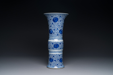 A Chinese blue and white 'chrysanthemum scroll' 'gu' vase, Kangxi