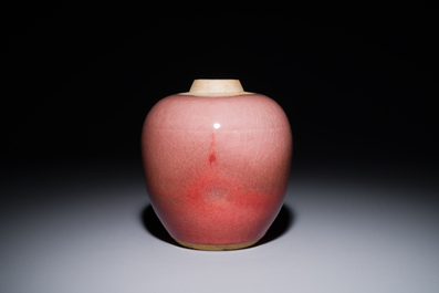 A Chinese monochrome copper-red-glazed ginger jar with a reticulated wooden cover, 18/19th C.