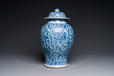 A Chinese blue and white 'lotus scroll' vase and cover, Kangxi