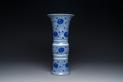A Chinese blue and white 'chrysanthemum scroll' 'gu' vase, Kangxi